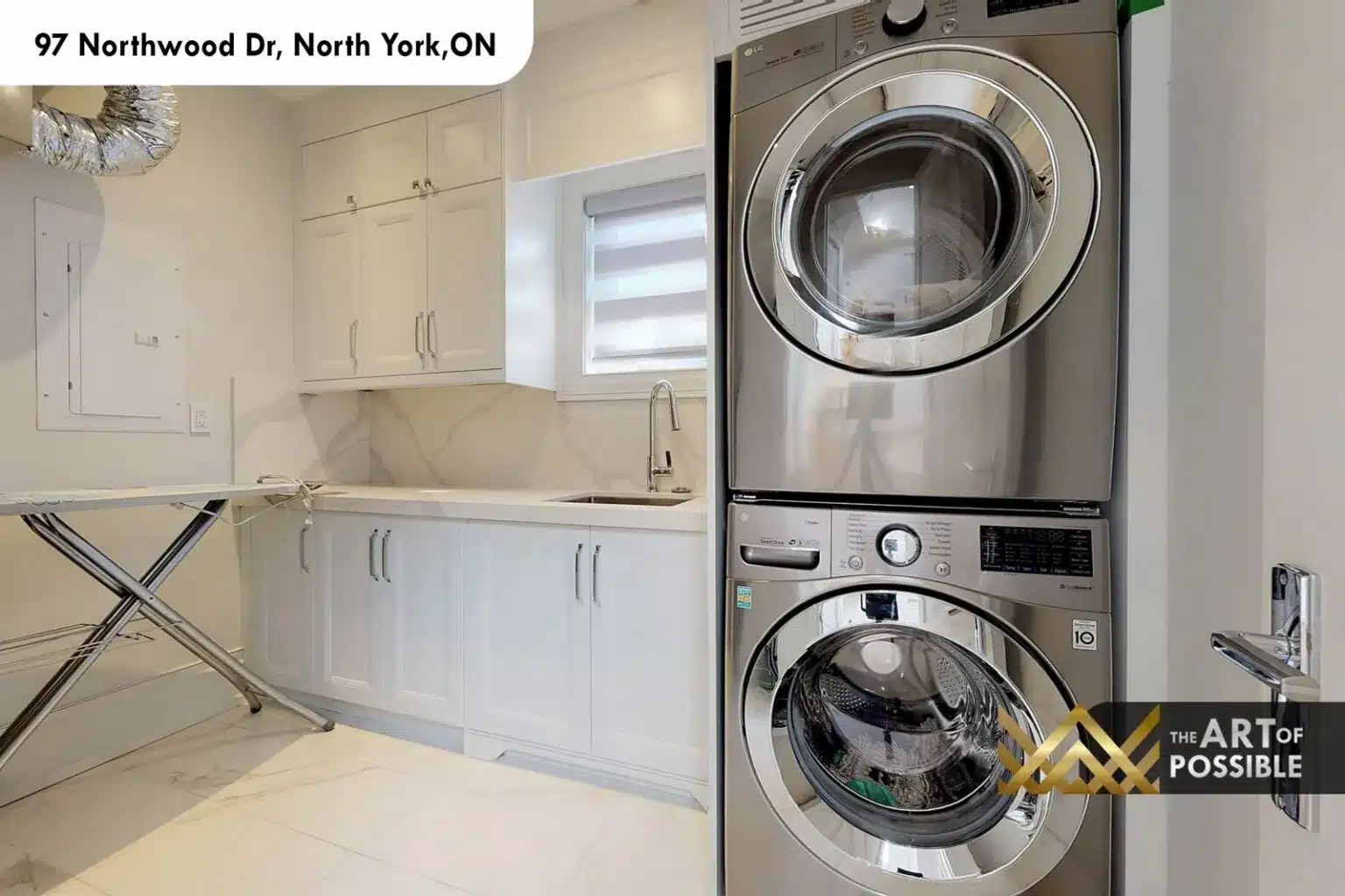 97 Northwood Dr upper floor laundry room white cabinetry stacked LG washer dryer marble countertop