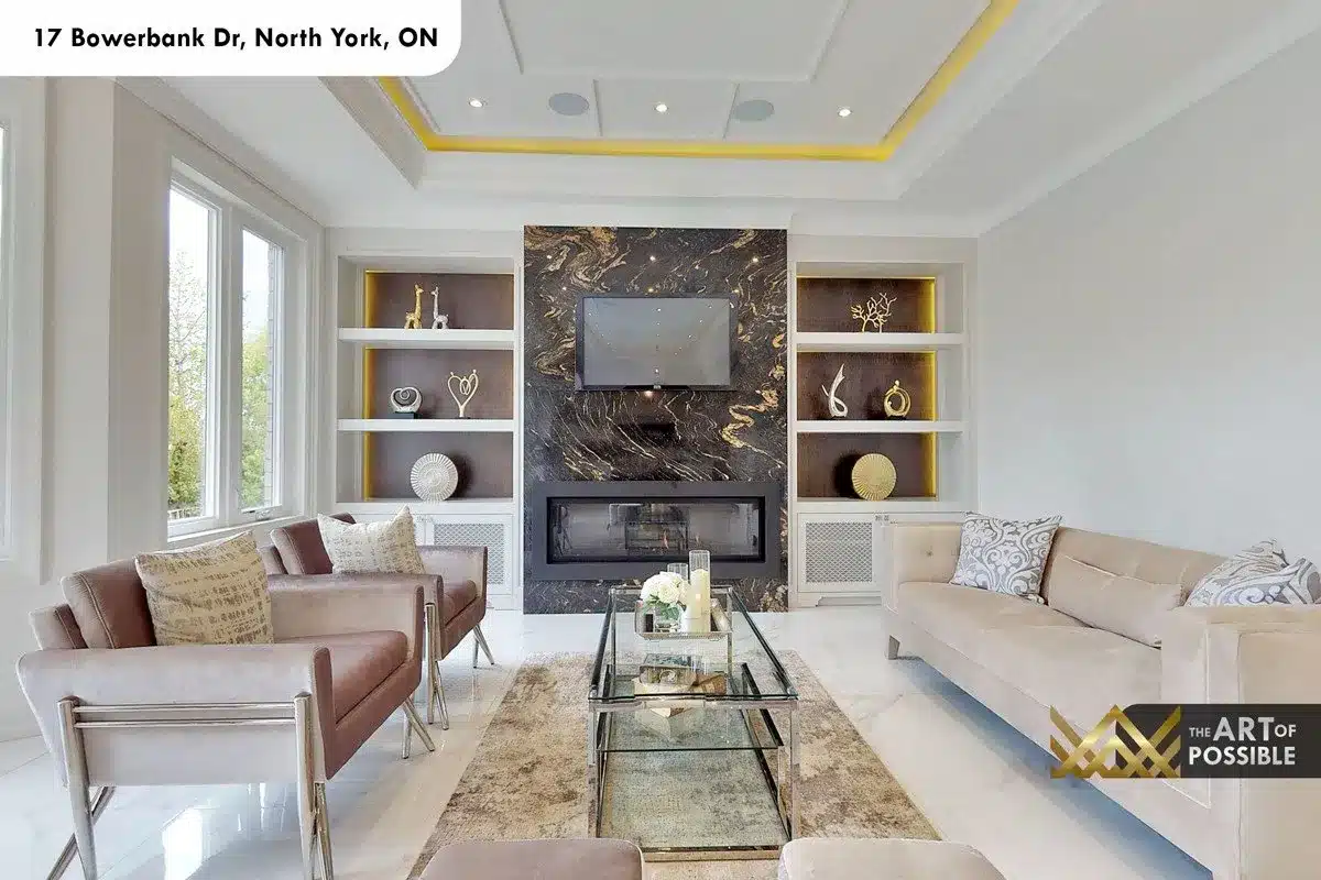 Family room black-and-gold marble feature wall with linear fireplace and built-in shelving at 17 Bowerbank Drive