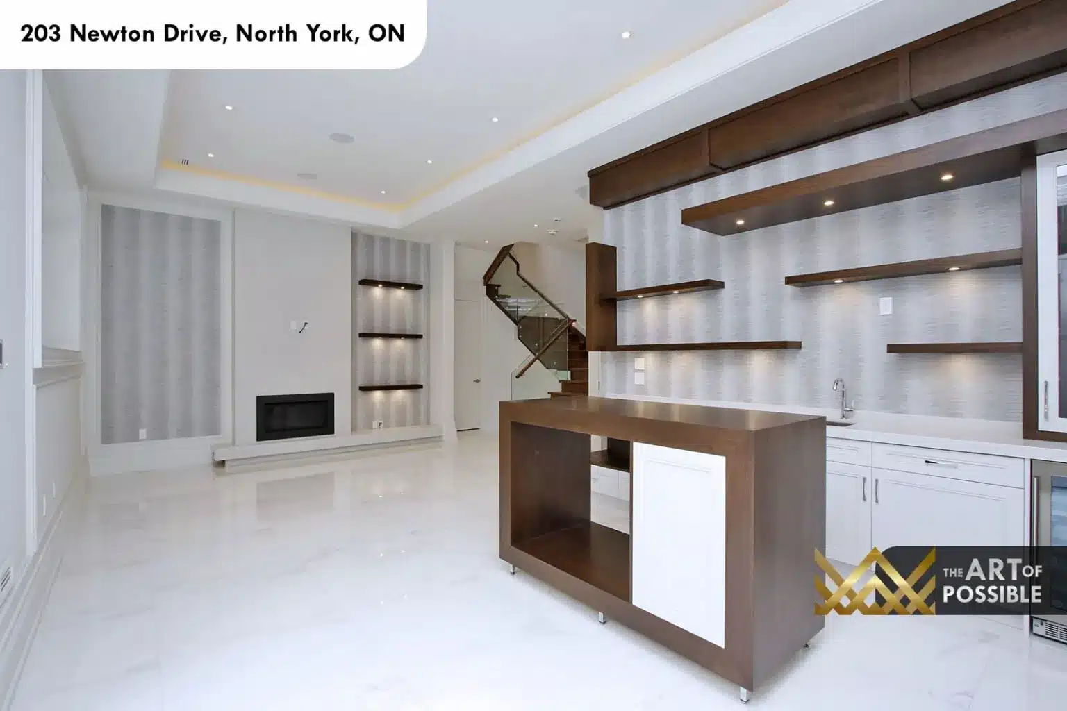 Recreation room and wet bar with marble floors and glass-railed staircase