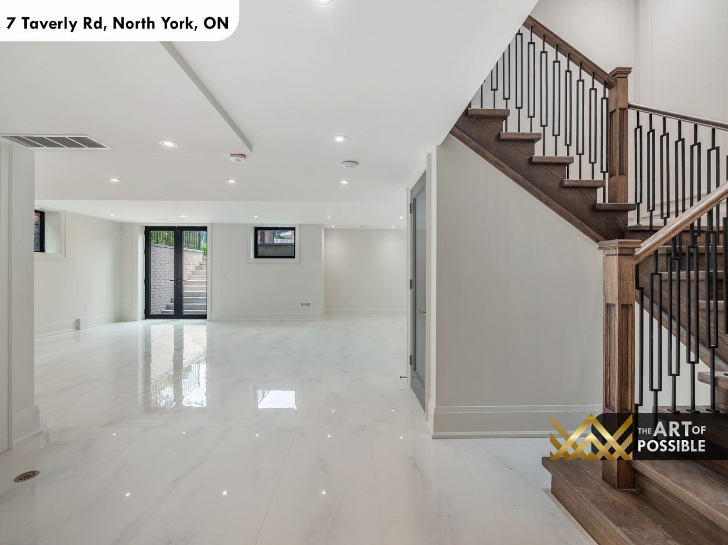 Finished walkout basement with polished white tile floors