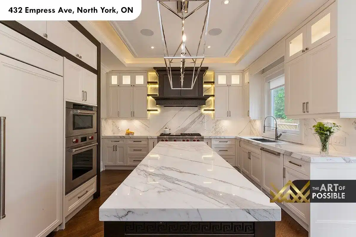 432 Empress Ave - kitchen with marble island, marble slab backsplash and carved walnut range hood