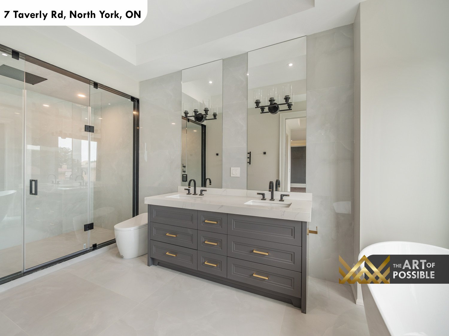 Primary ensuite double vanity with matte black mirrors and candelabra sconces