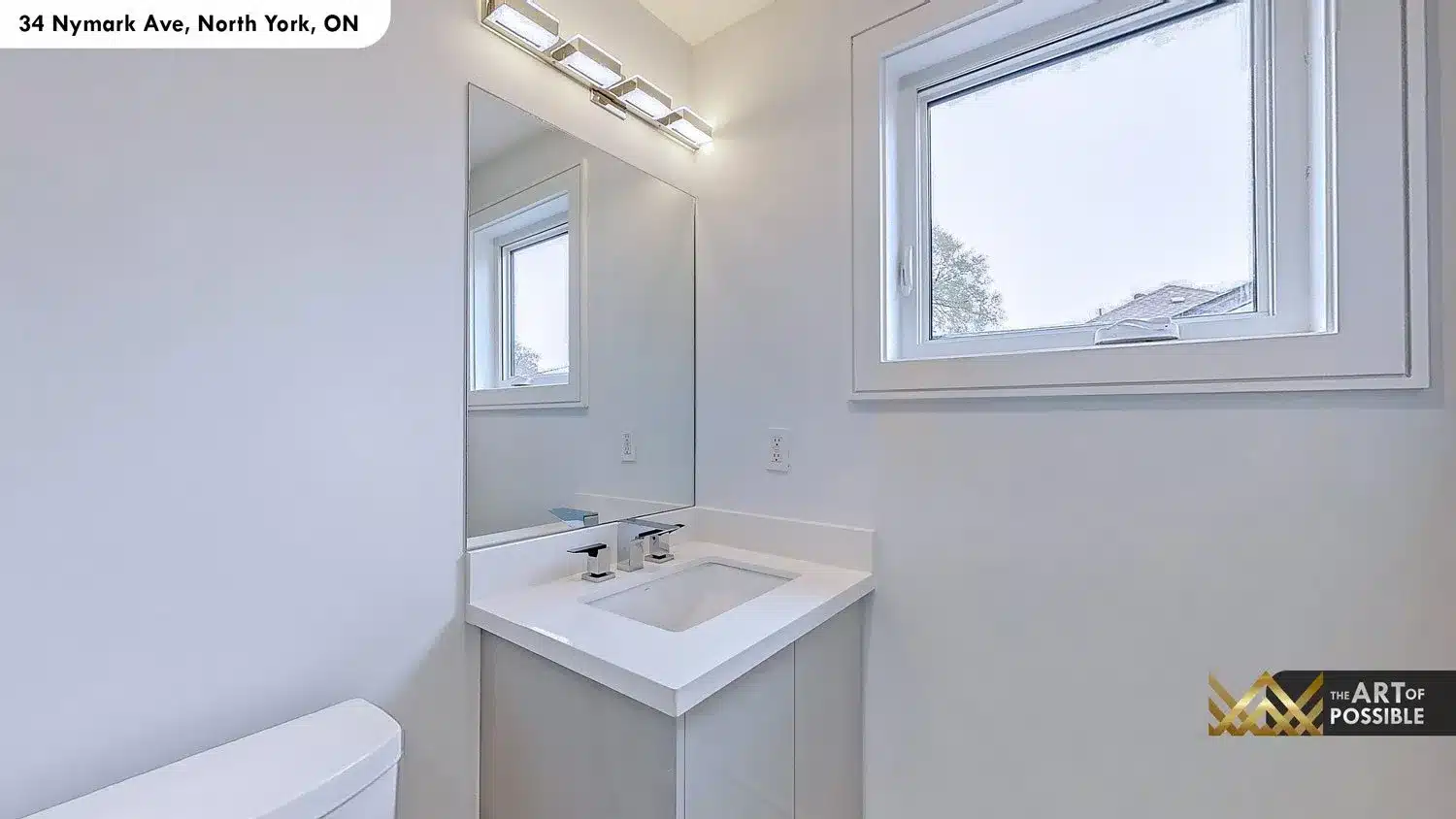 Powder room with white vanity, white quartz countertop and chrome angular faucet