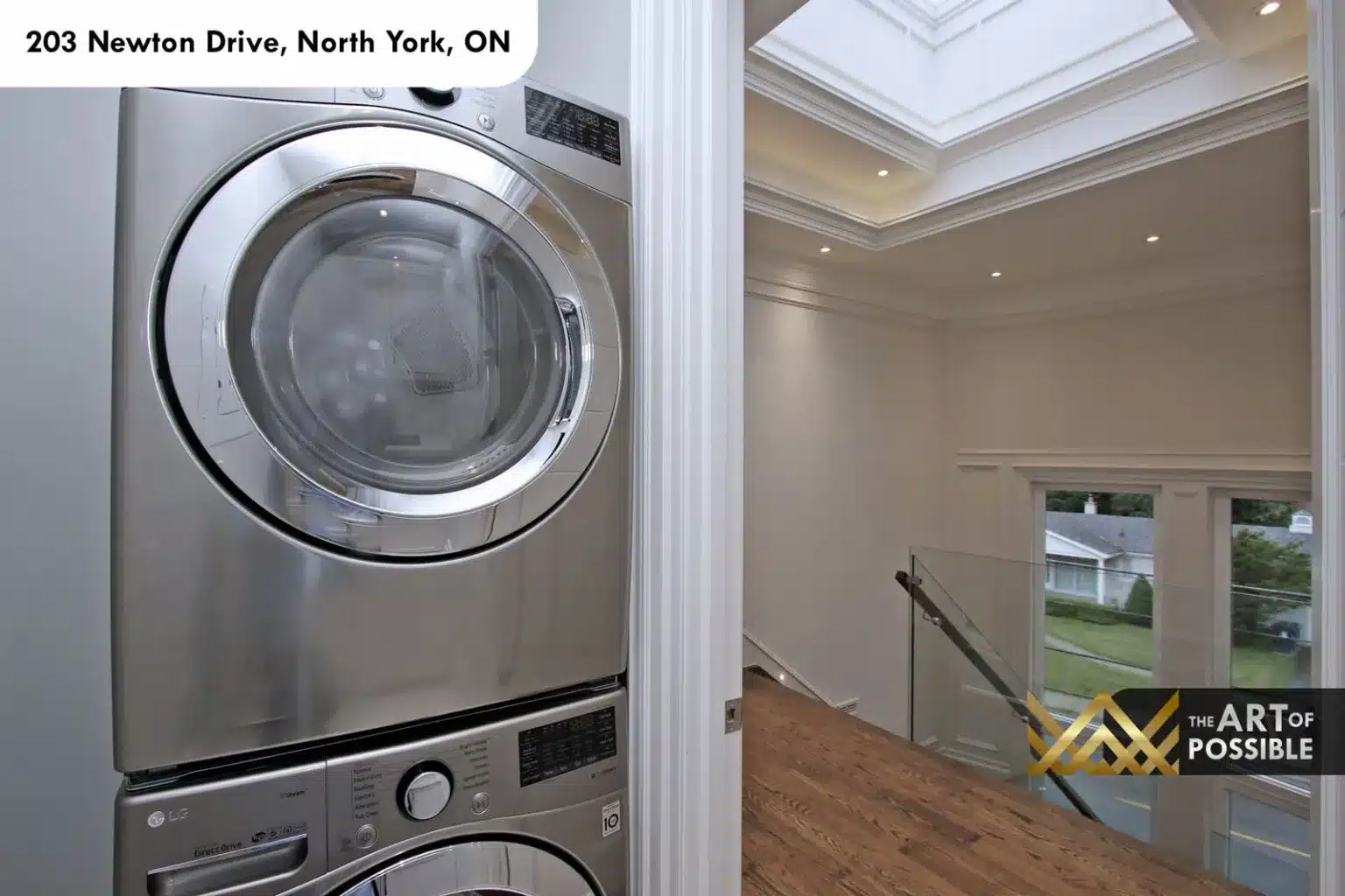 Upper-floor laundry with stacked LG washer and dryer