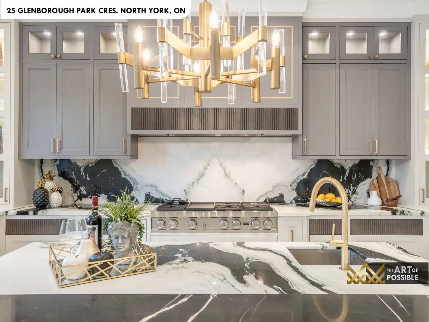 Living room with coffered ceiling and bookmatched dark marble fireplace wall