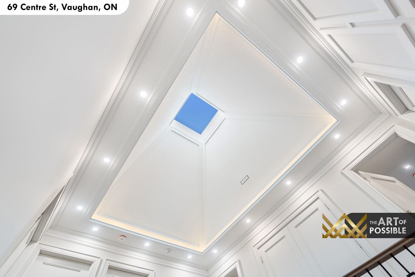 Upper floor skylight foyer with coffered pyramid ceiling and LED cove lighting