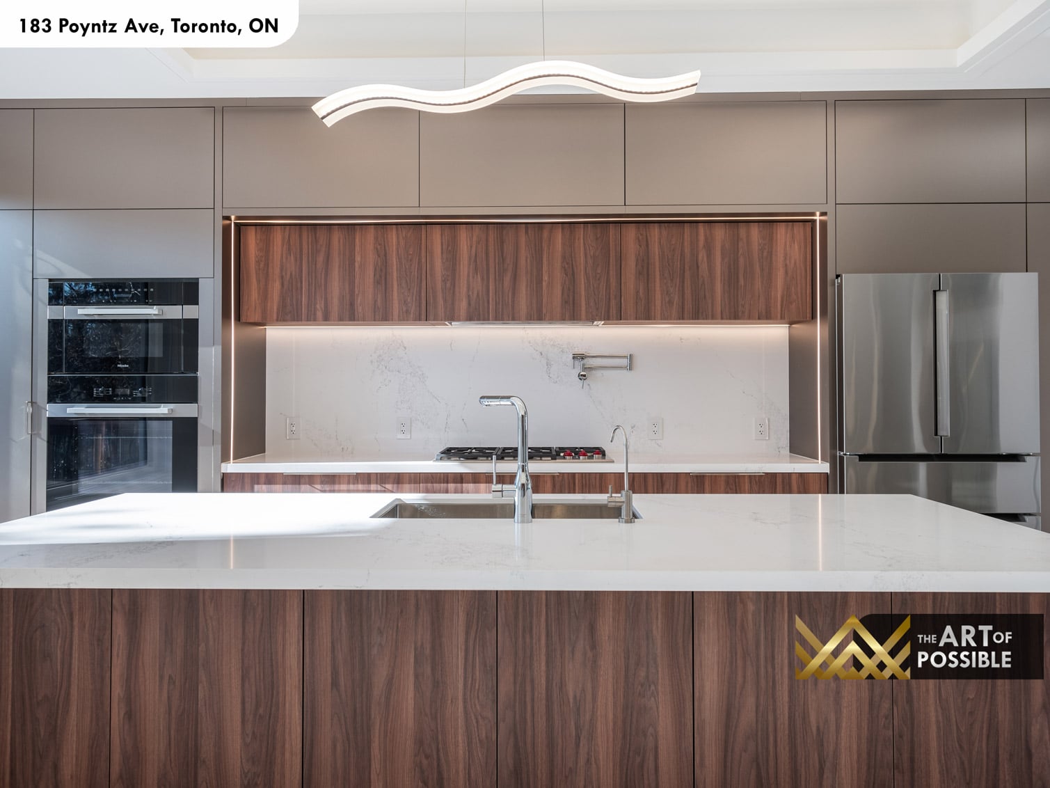 183 Poyntz Ave North York kitchen island marble countertop with Miele oven tower and pot filler detail