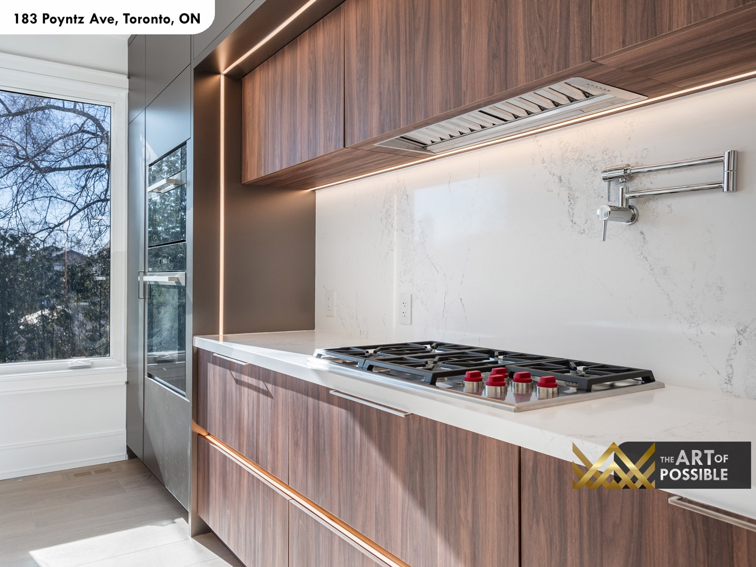 183 Poyntz Ave North York kitchen cooktop detail with marble slab backsplash and under-cabinet LED lighting