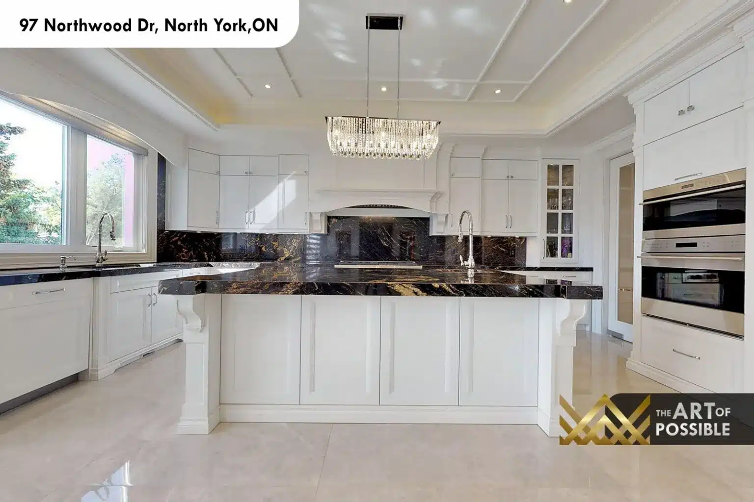 97 Northwood Dr kitchen island white cabinetry black marble countertop wall ovens chandelier