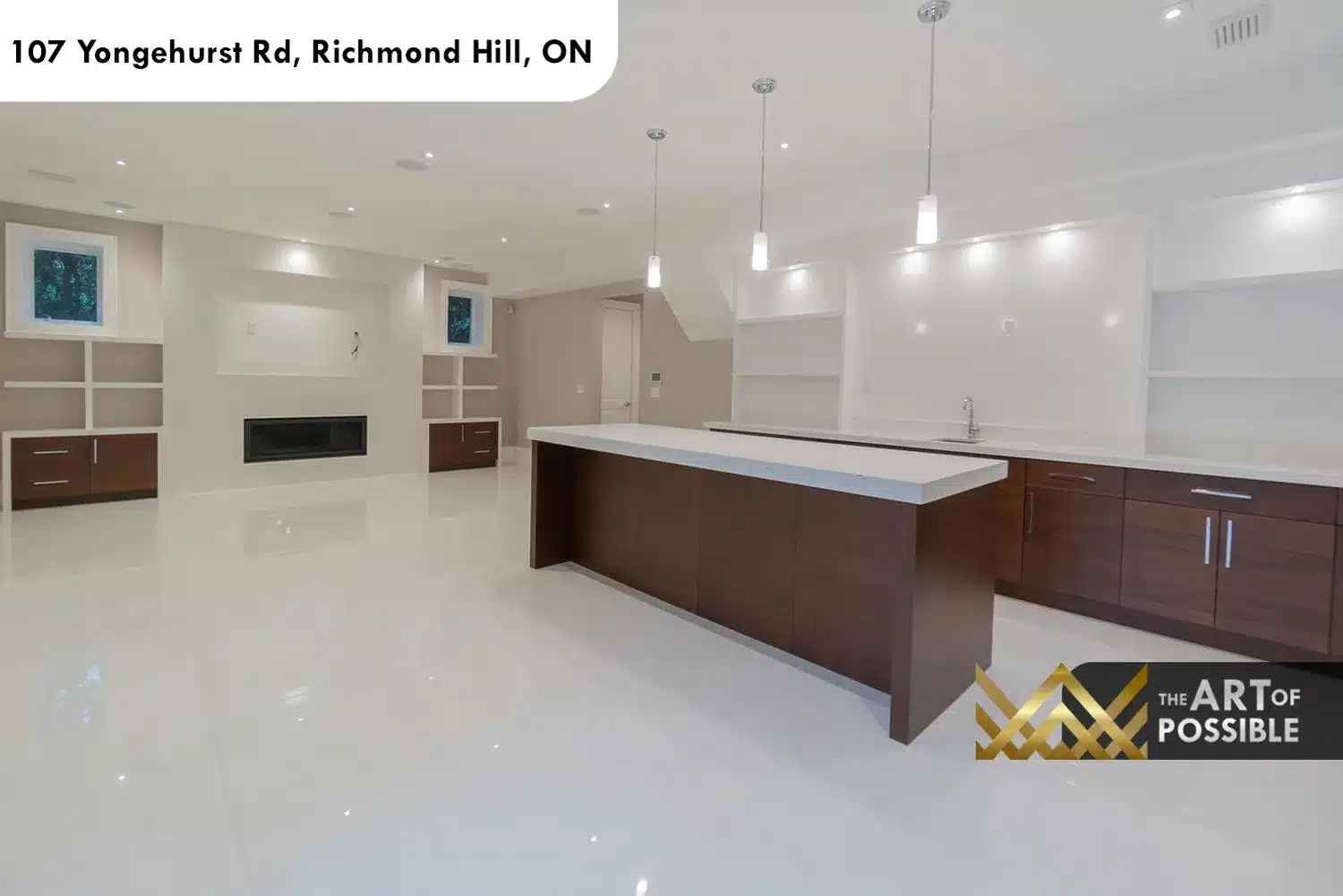 Lower level recreation room with walnut wet bar island, white open shelving and chrome pendant lights