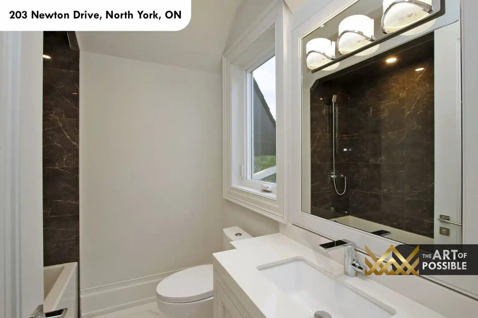 Bathroom finished in brown marble with glass shower
