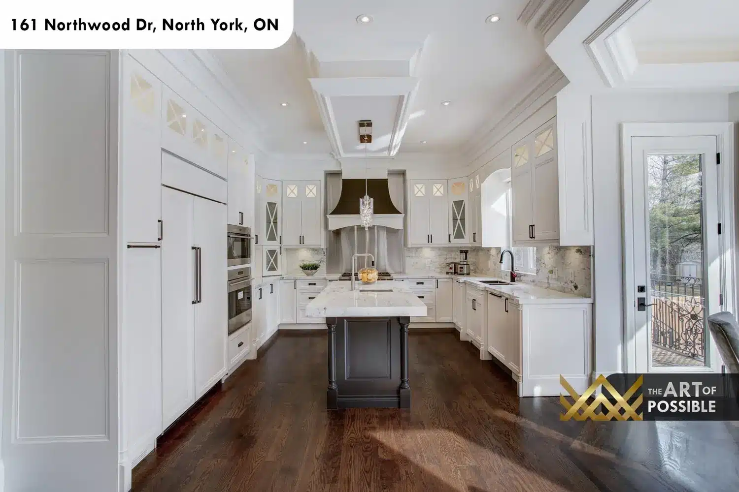 161 Northwood Dr North York kitchen white cabinetry espresso island Wolf range hood crystal pendants
