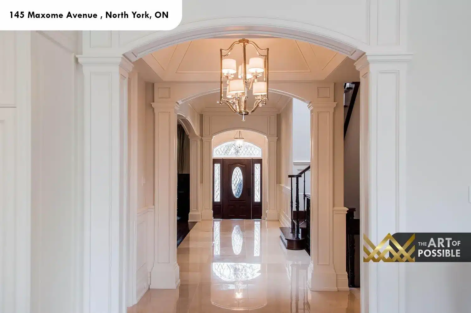 145 Maxome Avenue centre hall arched millwork nickel chandelier marble floor staircase