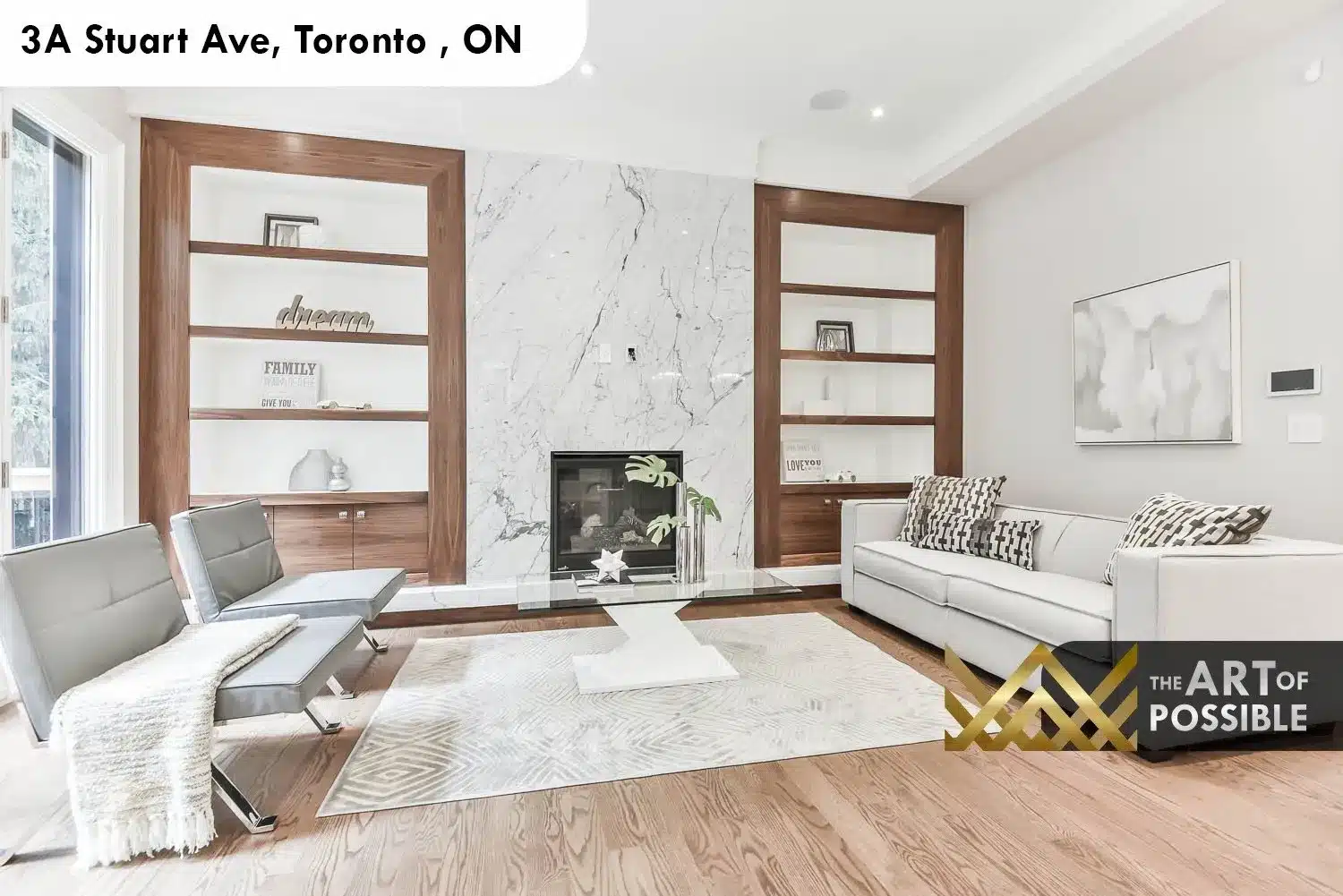 Family room at 3A Stuart Ave with marble fireplace flanked by walnut built-in shelving units