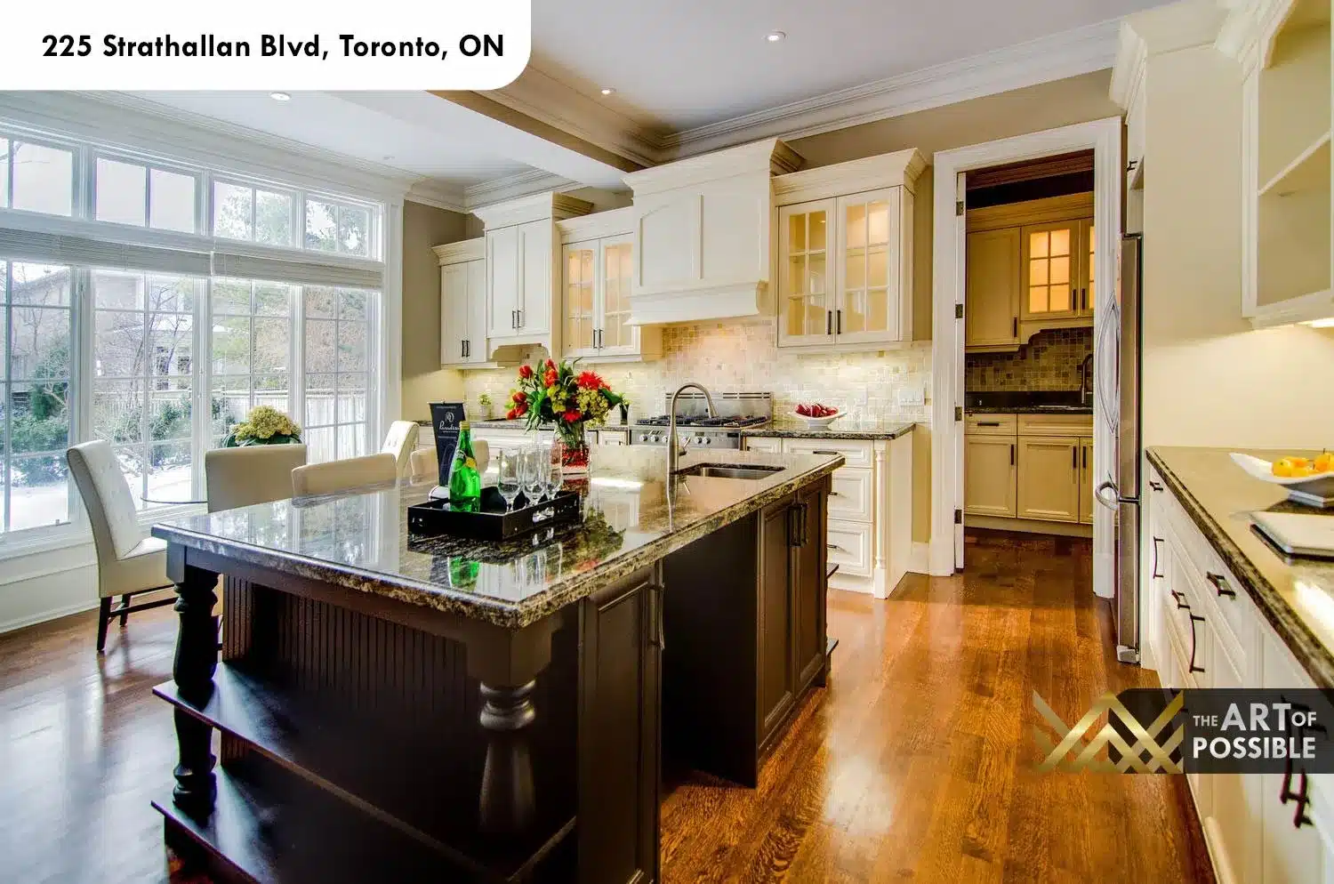 225 Strathallan Blvd Toronto - Kitchen with white cabinetry and dark island