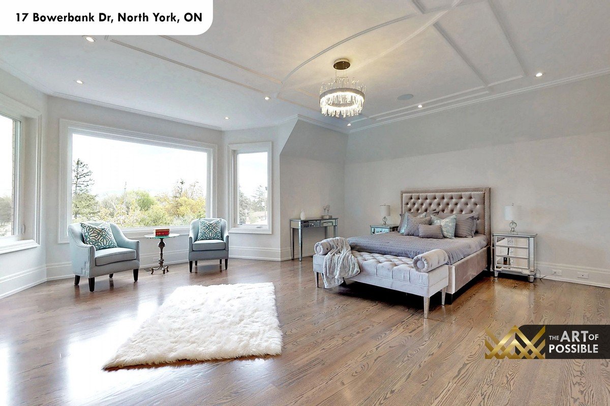 Primary bedroom with coffered barrel ceiling, crystal chandelier and bay window sitting area at 17 Bowerbank Drive