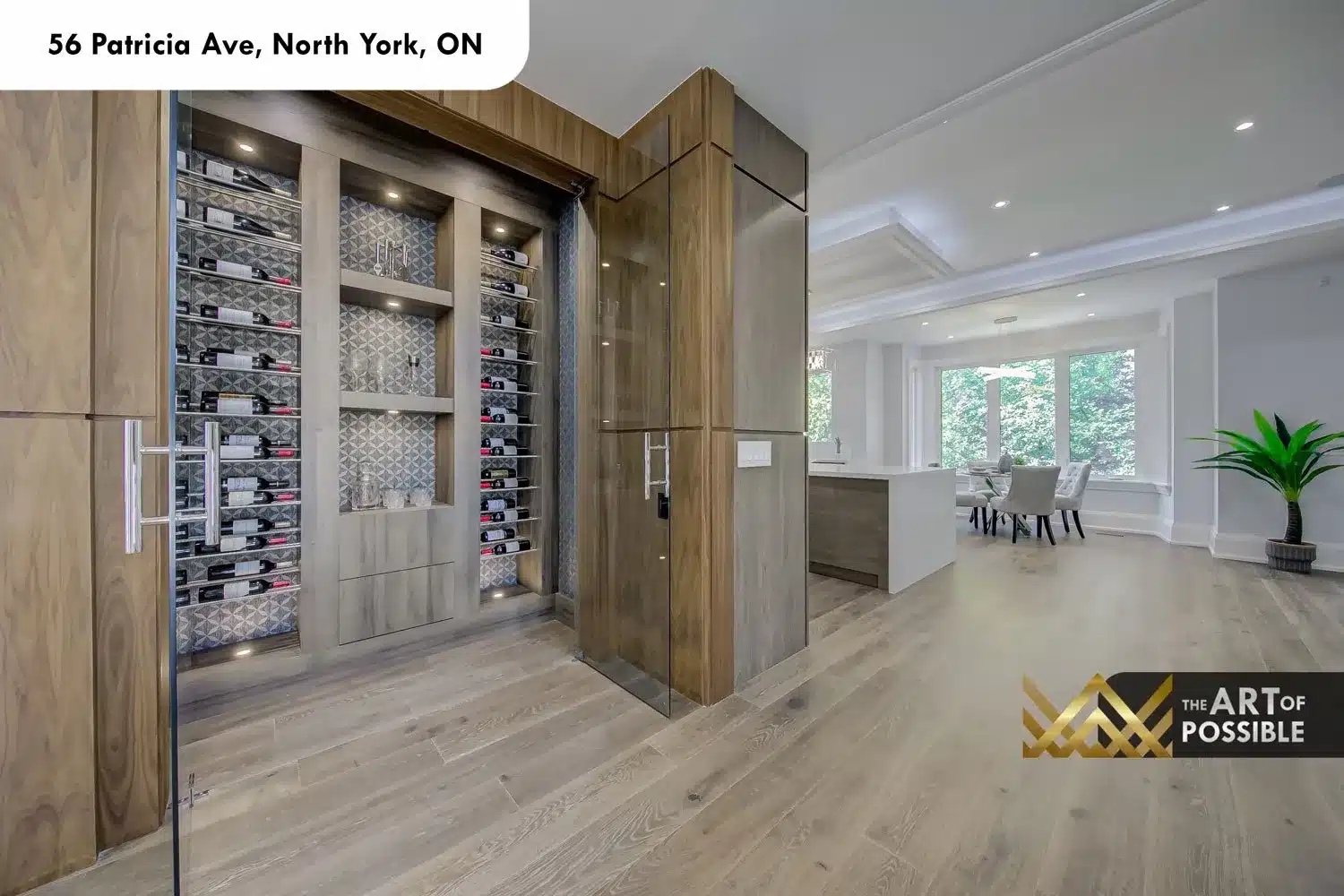 Wine storage cabinet with glass door and walnut framing at 56 Patricia Ave