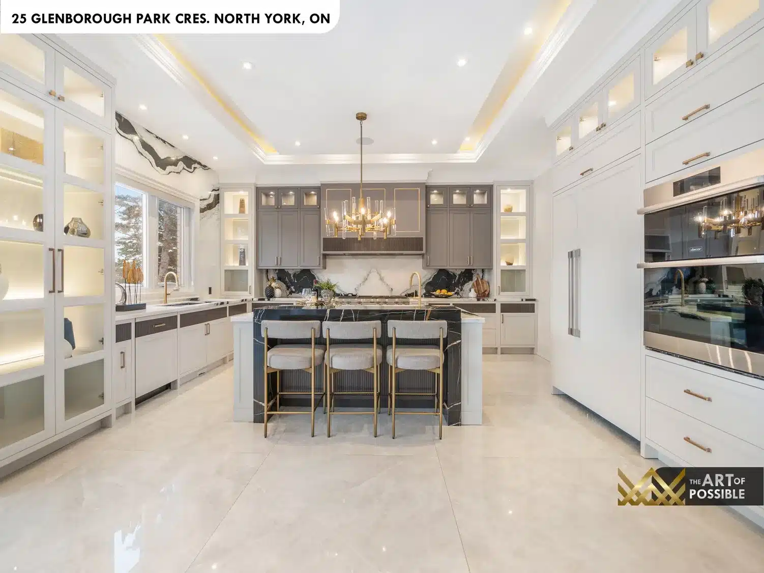 Kitchen perimeter white cabinetry and Dacor appliances
