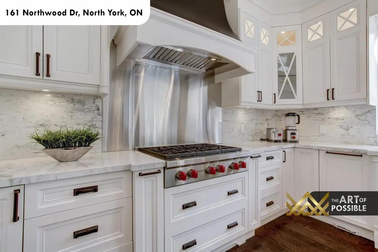 161 Northwood Dr North York kitchen Wolf 6 burner range red knobs marble slab backsplash dark range hood