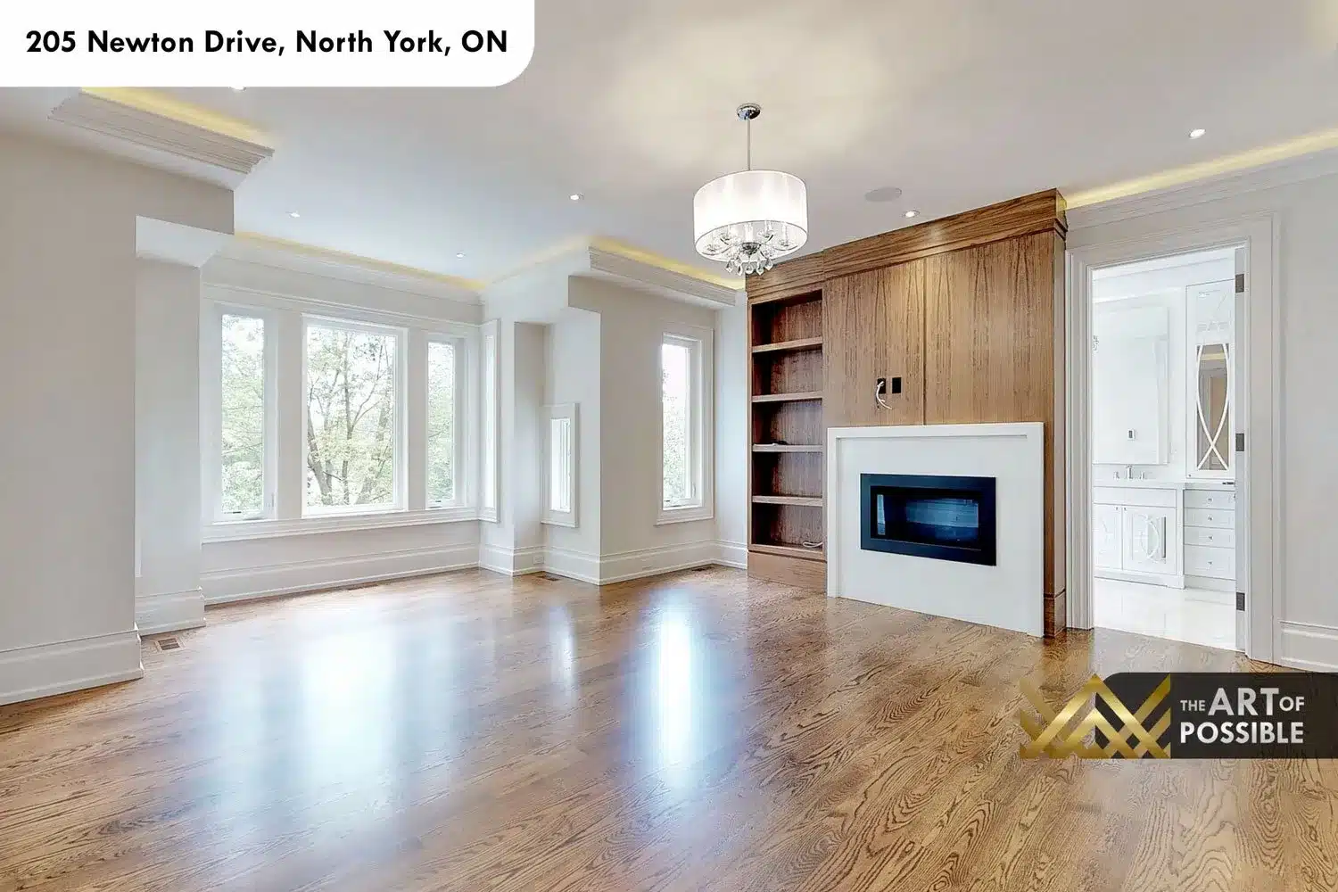 205 Newton Drive primary bedroom walnut built-in fireplace crystal chandelier